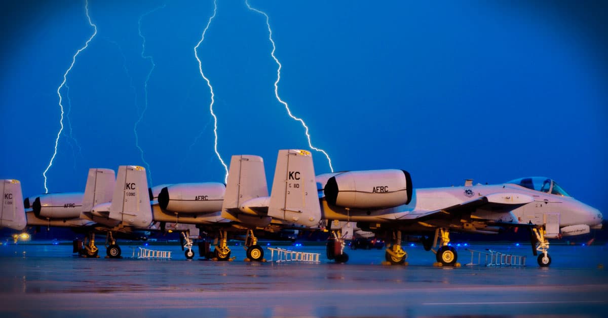 A-10-Lighting strikes behind A-10 Thunderbolt IIs on the Whiteman Air Force Base