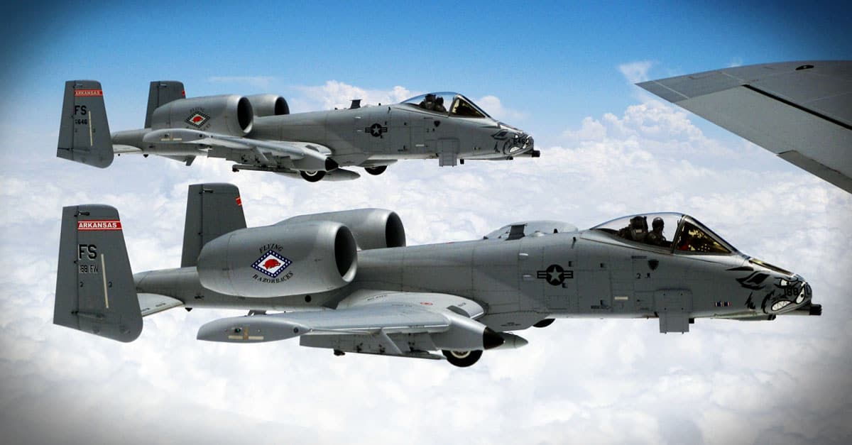 A-10_Two A-10 aircrafts fly in formation off the wing a KC-135 Stratotanker